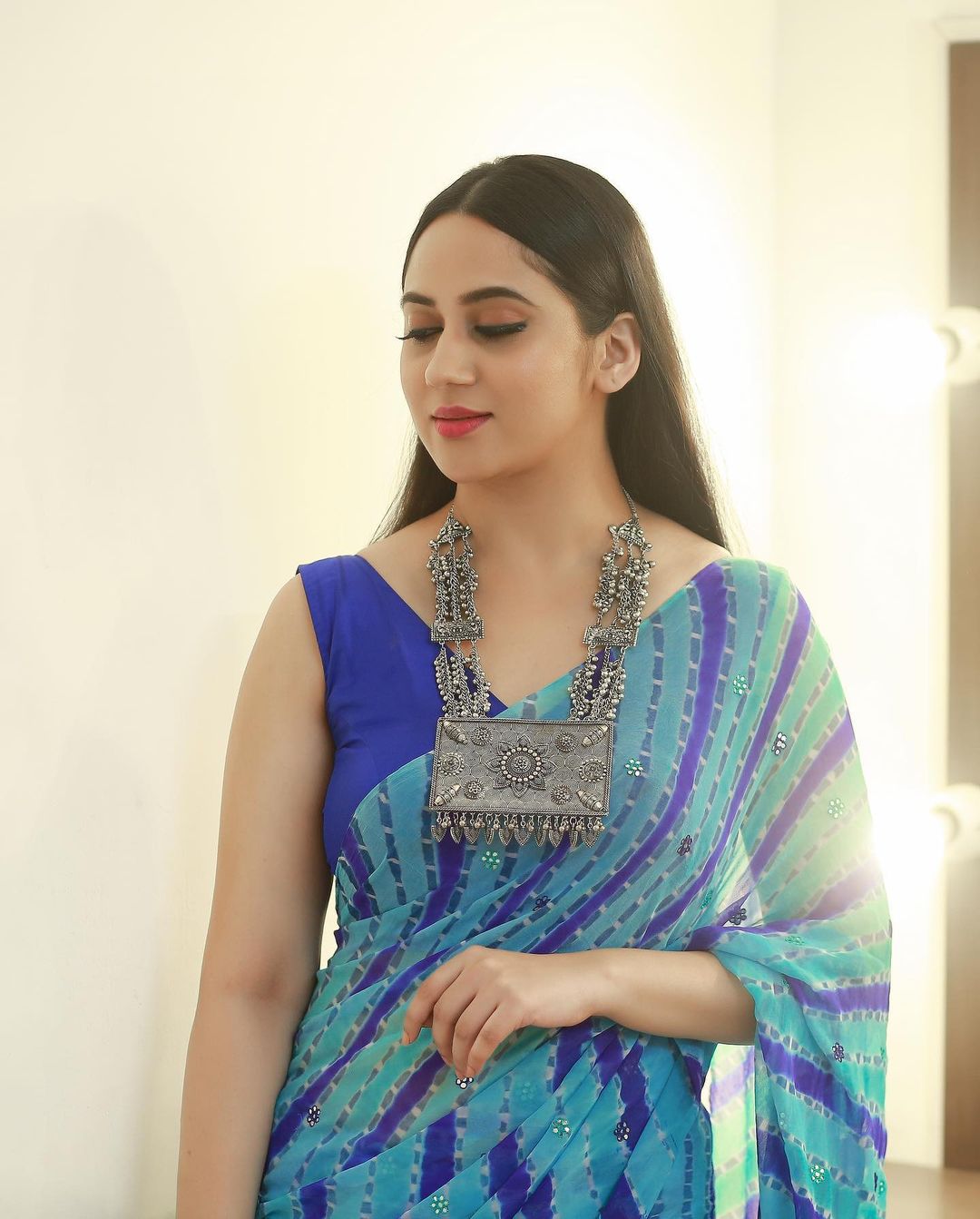 Malayalam Actress Miya George in Sleeveless Blue Saree